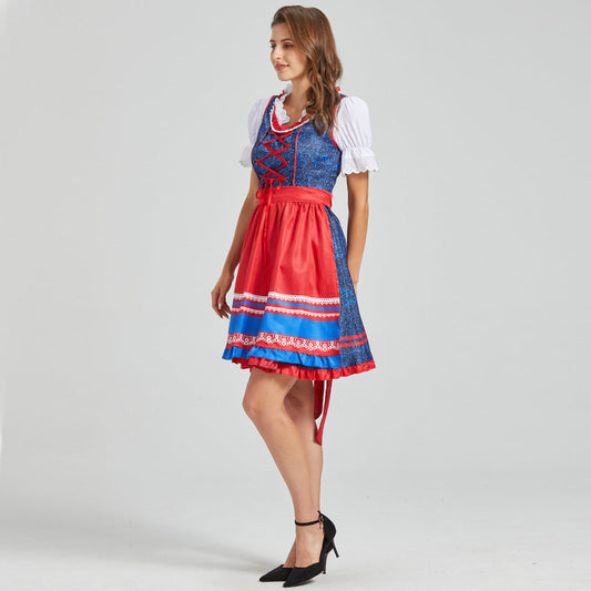 Festive dirndl with red apron and traditional details