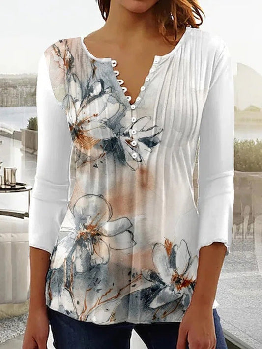Blusa de flores degradadas con botones decorativos